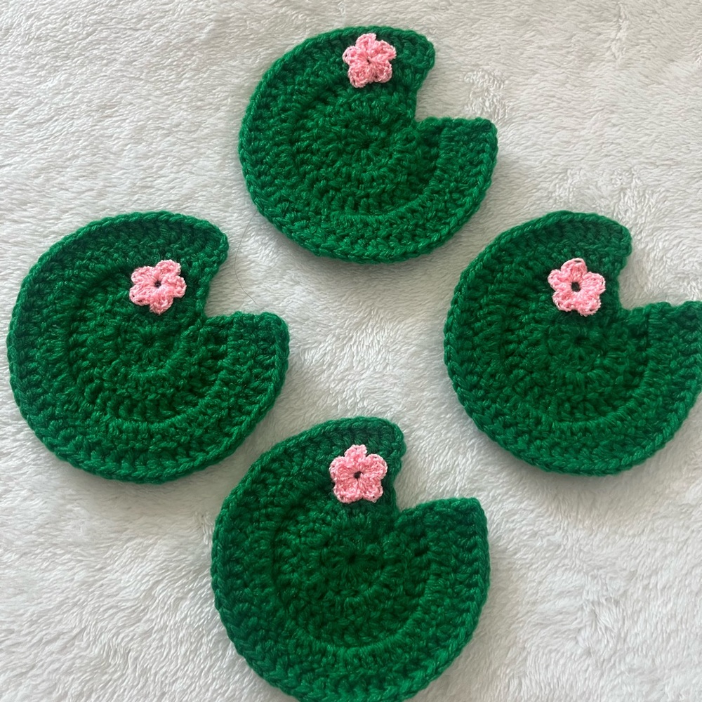Green Lily Pad Crochet Coasters with Pink Flower Accents